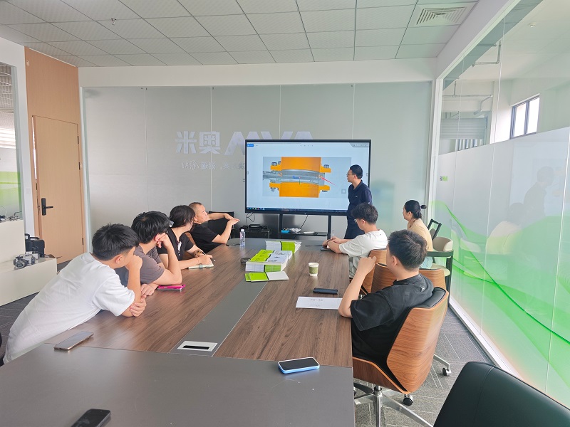 AVM technical team presenting valve engineering details during internal product training